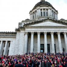 Washington State Capitol Building with activist crowd